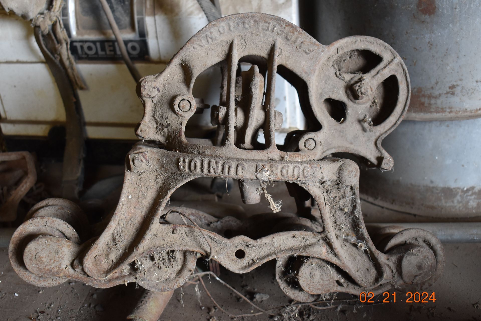 Old metal rope device with the word junior on it.