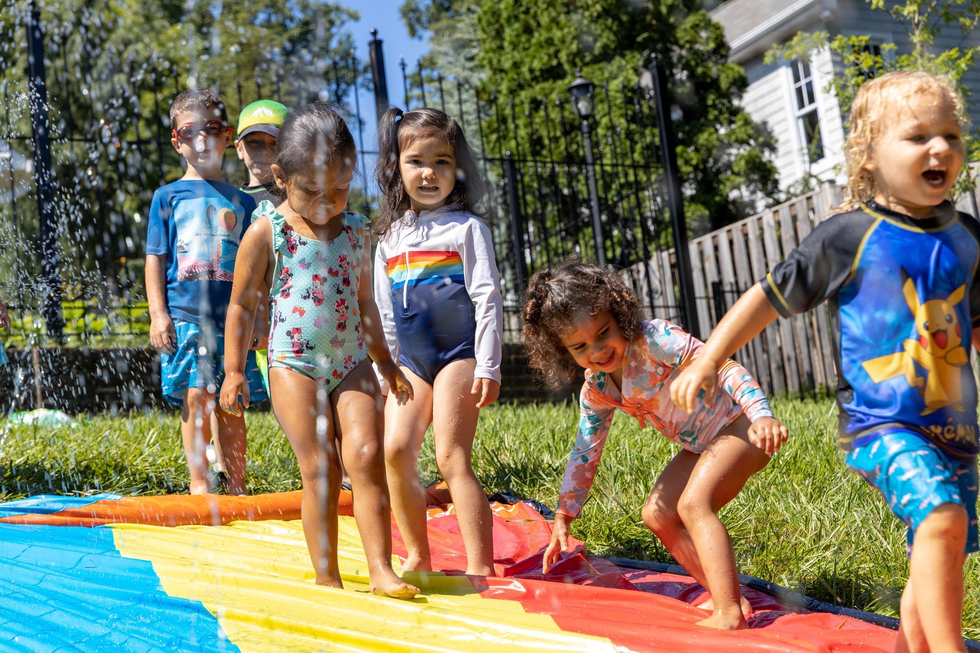 Montessori children during water play