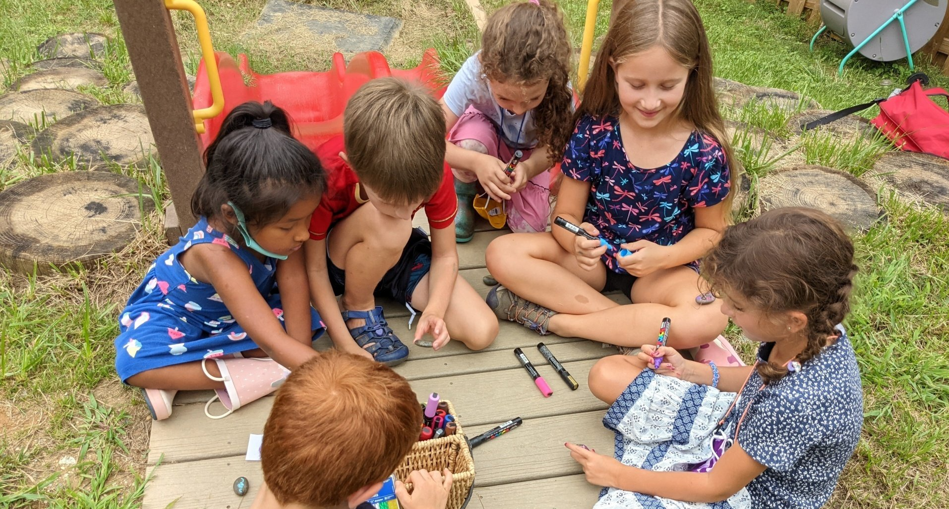 Montessori children working outdoors