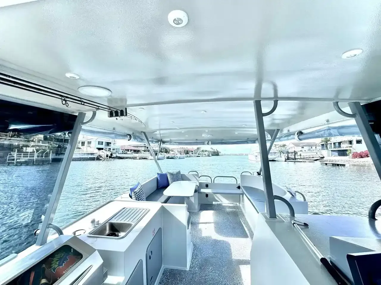 Spacious, clean interior of a luxury rental boat, an ideal venue for a productive corporate team building Gold Coast event.