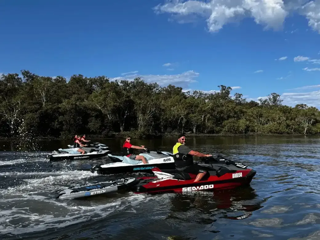 Detailed infographic showing water-jet propulsion system with arrows indicating water flow from intake through impeller chamber to high-pressure exit nozzle, including pressure and velocity measurements - how do jet skis work infographic 