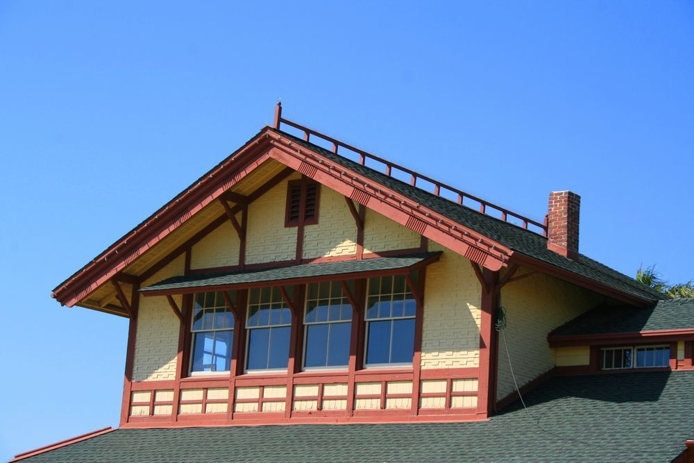 A House With A Roof That Has A Chimney On It — Jay's Tint in Smithfield, QLD