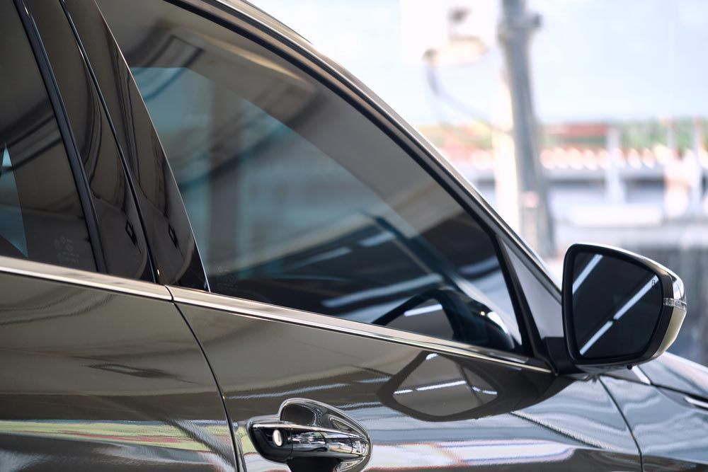 TInting The Window Of A Black Car