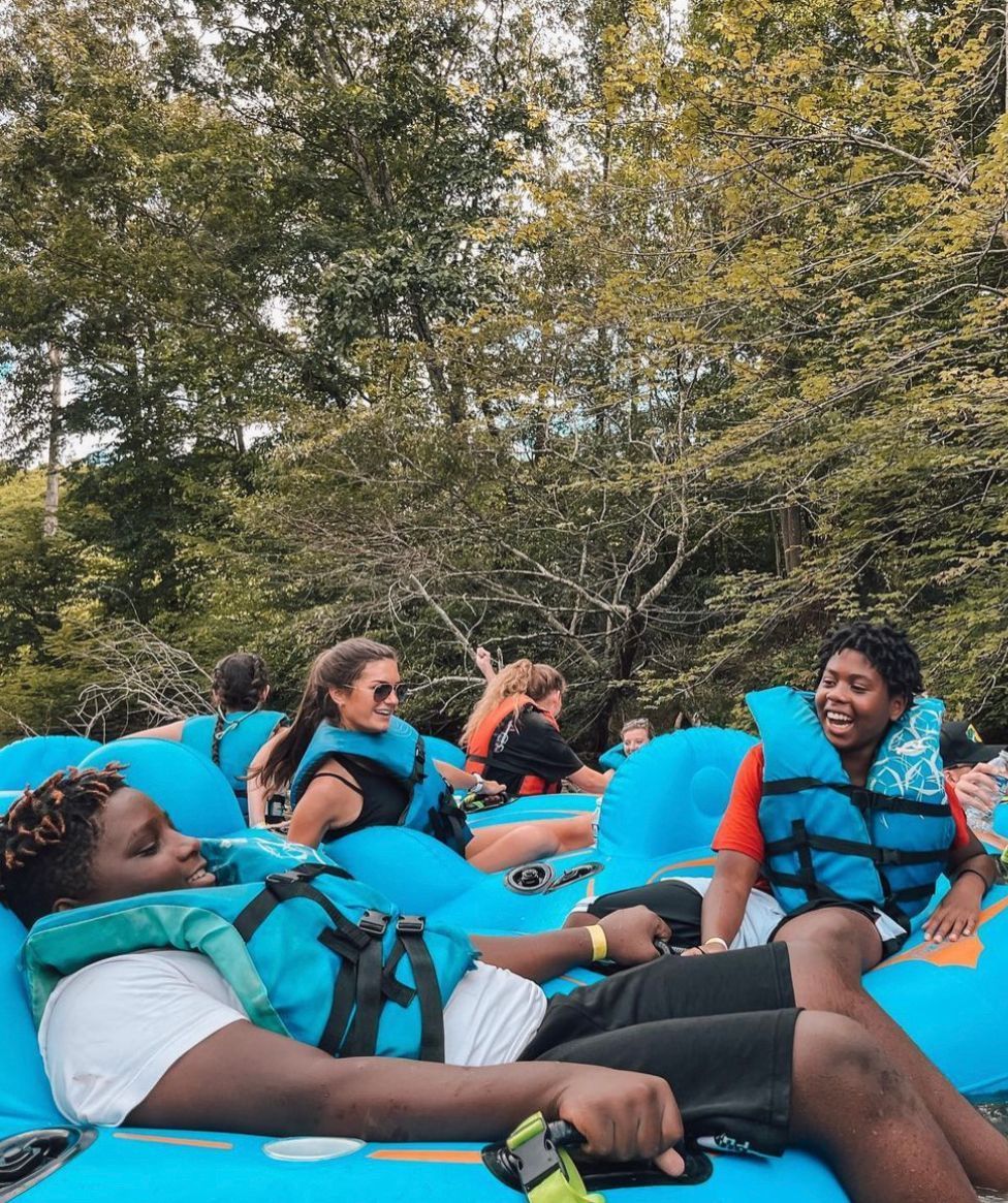 Group of people floating on tubes with Saluda Outdoor River Company on the Saluda River in Greenville, SC