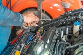 Mechanic Performing Engine Bay Maintenance | Burtonsville Automotive Services