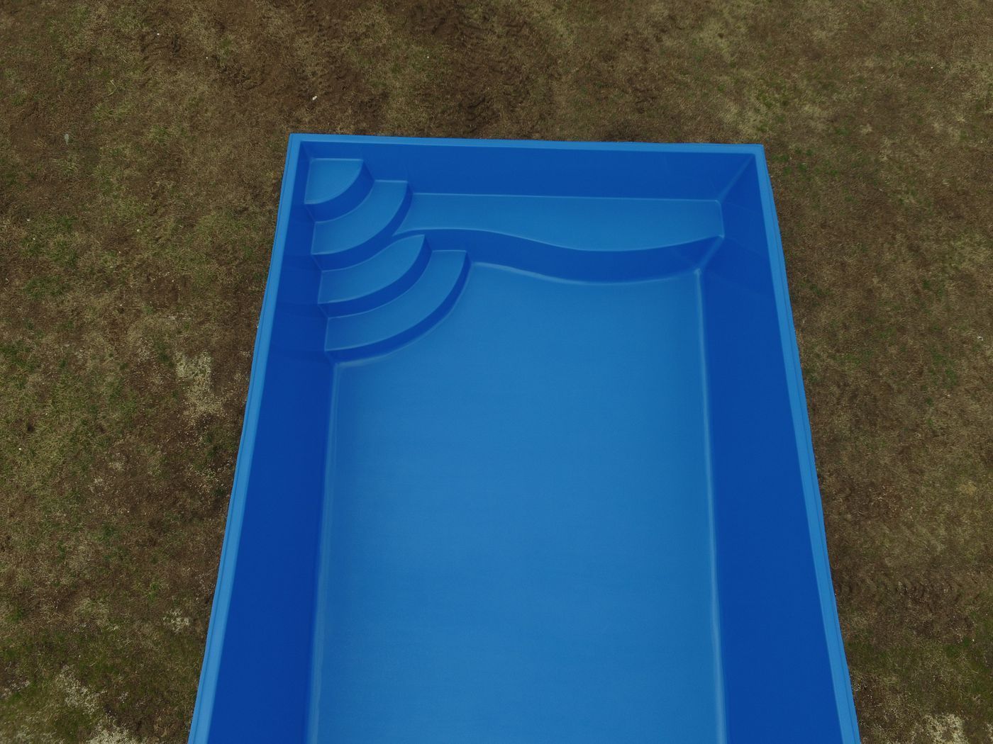 Blue empty above-ground pool viewed from above, sitting on grass.