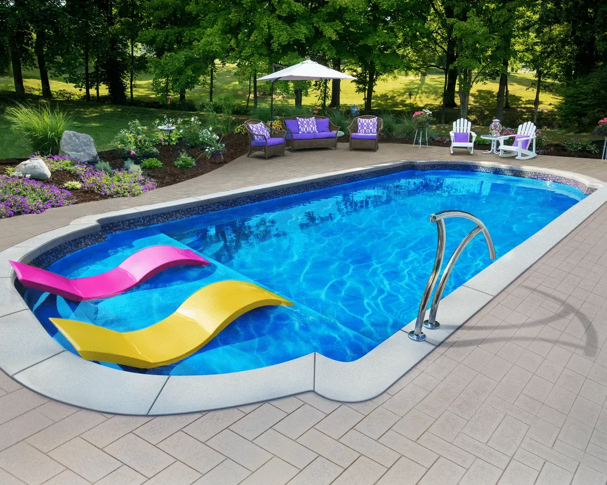 Backyard pool with colorful floating loungers, patio chairs, and trees in the background