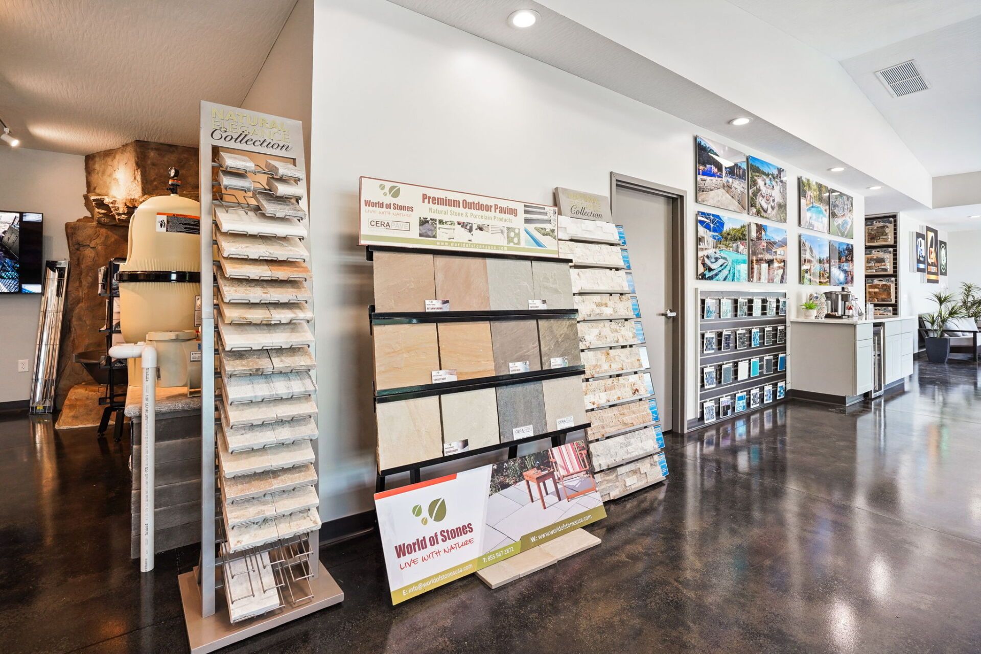 Bright, modern lobby with brochure racks, display shelves, and polished dark floors.