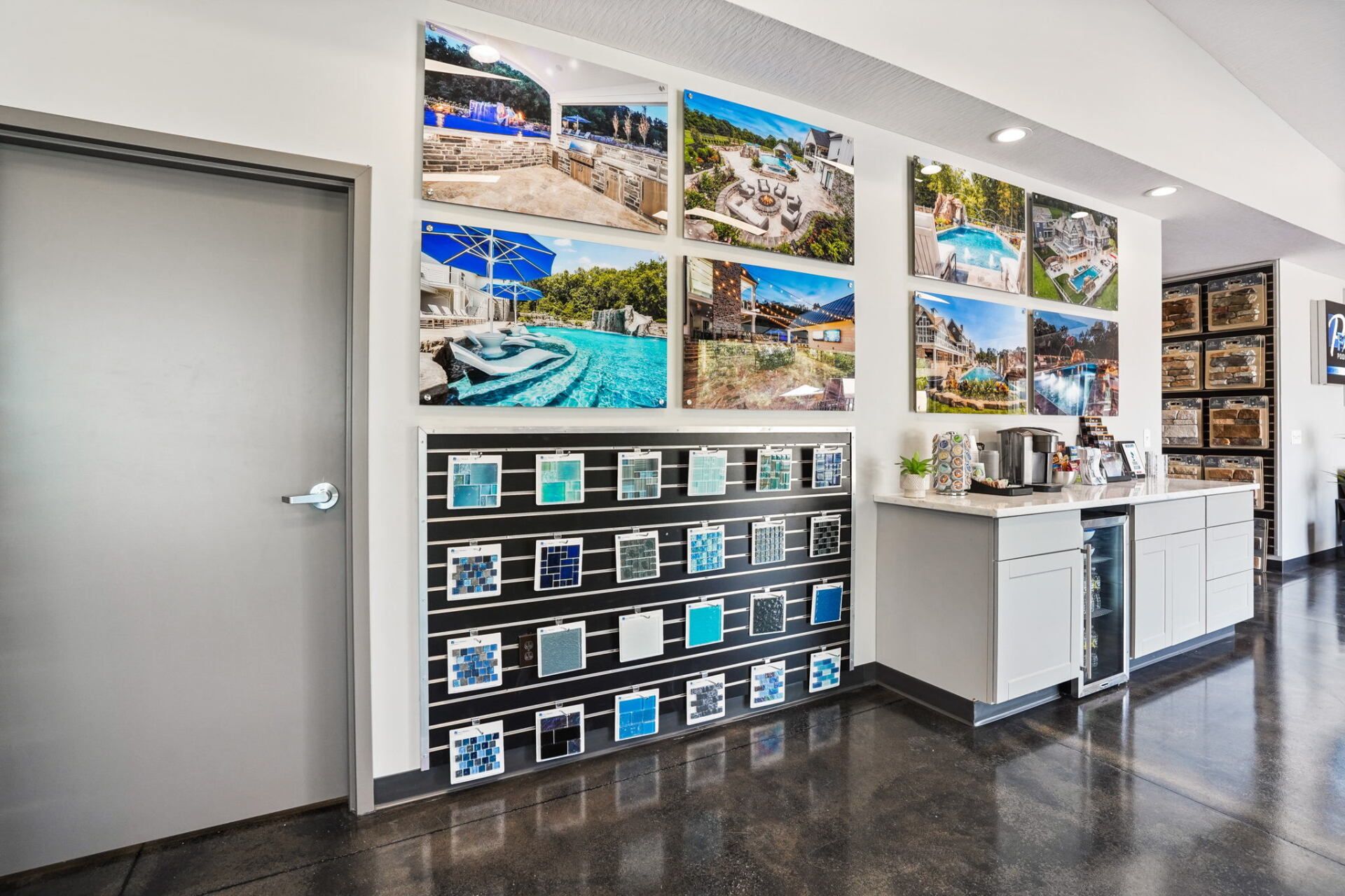 Bright office lobby with travel photos, brochure rack, and reception counter on a glossy floor