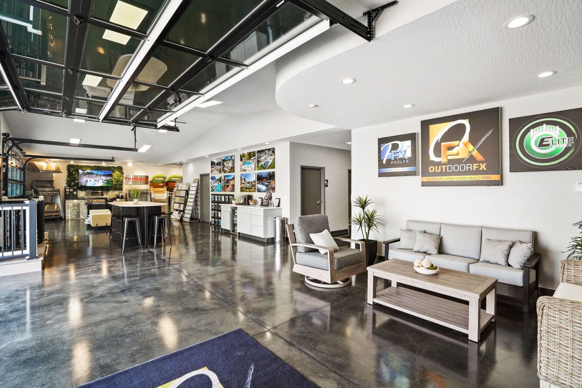 Modern office lobby with polished floors, seating, wall art, and reception area