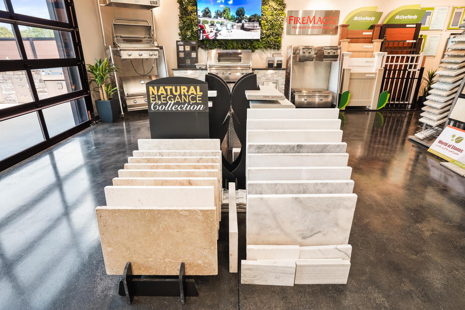 Tile store showroom with rows of large stone and tile samples displayed on stands