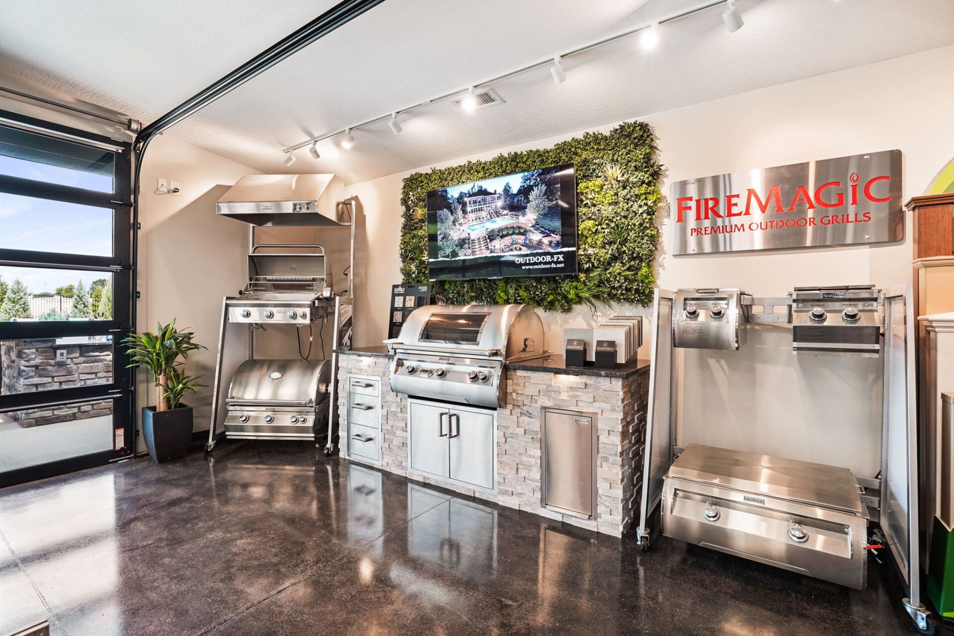 Modern stainless-steel drink station with TVs, fountain machines, and a green plant wall