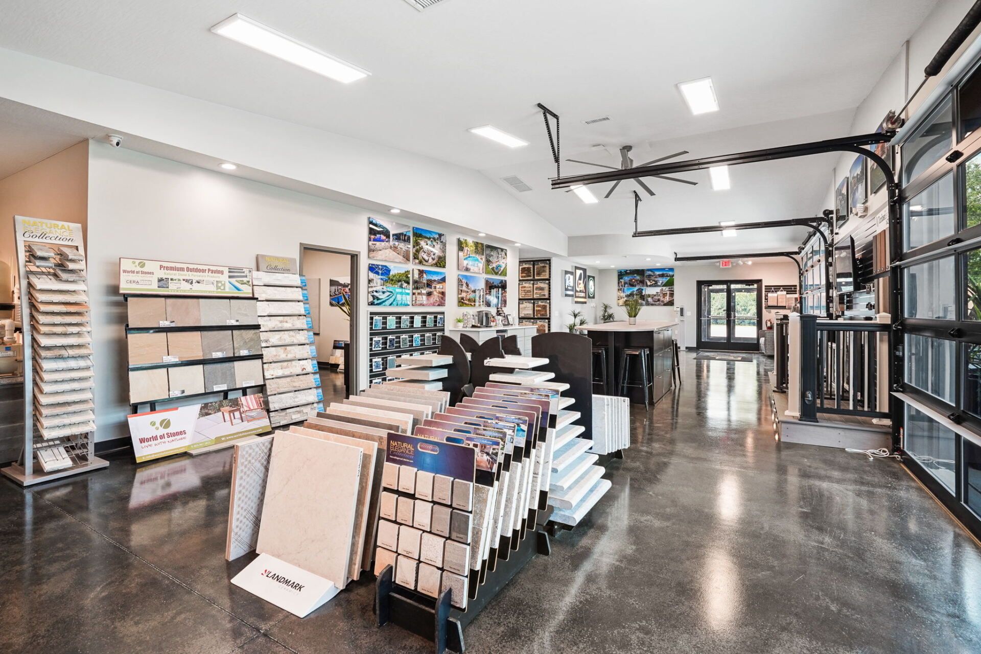Bright modern retail shop interior with shelves, display racks, and a polished concrete floor