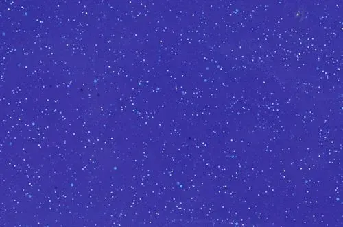 Purple starry sky with scattered white specks