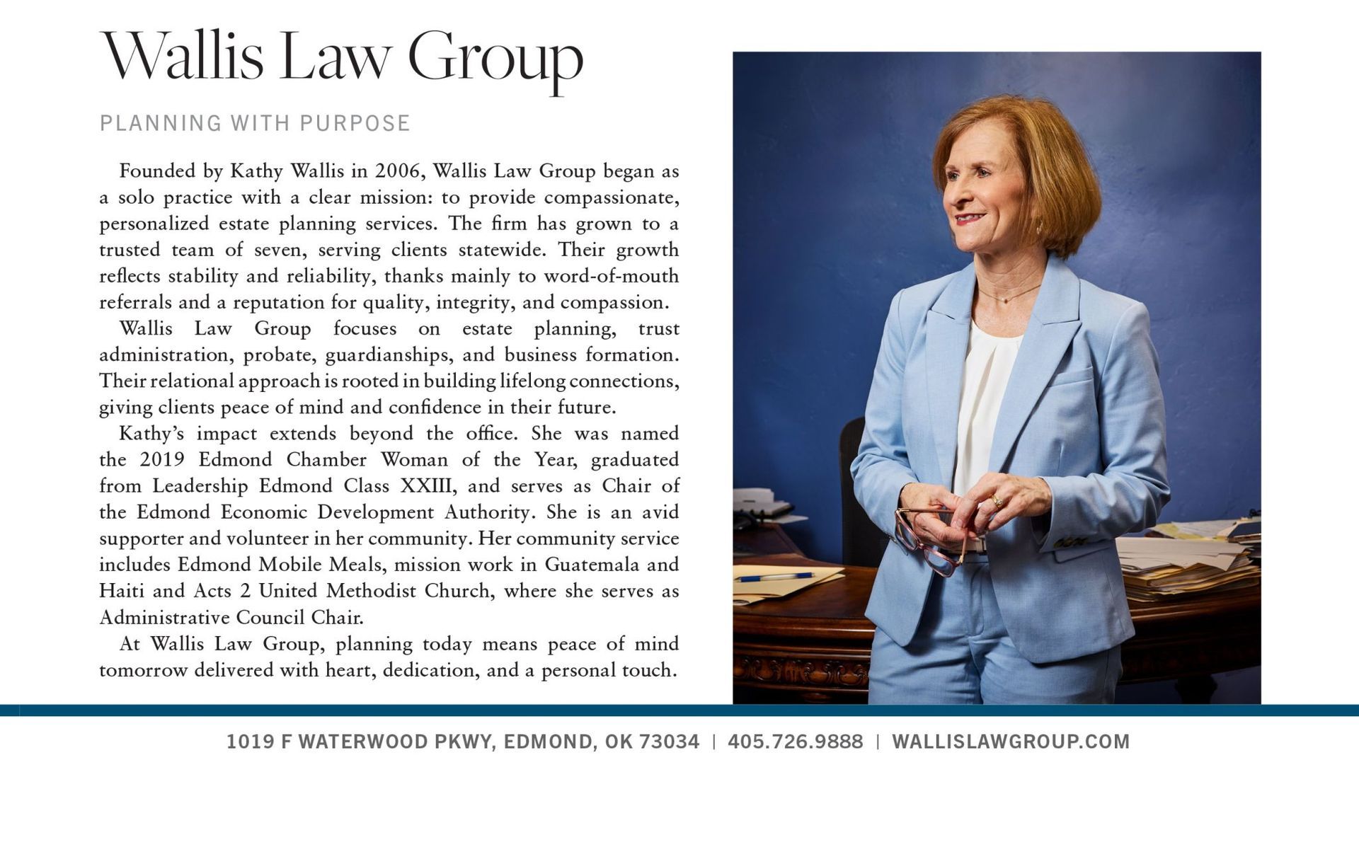 A woman in a light blue suit stands behind a desk next to text titled 
