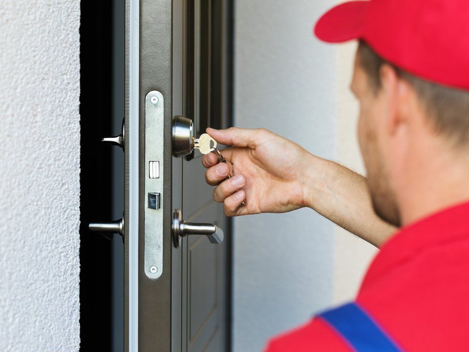 Locksmith Repairing Door Lock — Colorado Springs, CO — Henley’s Key Service Inc.