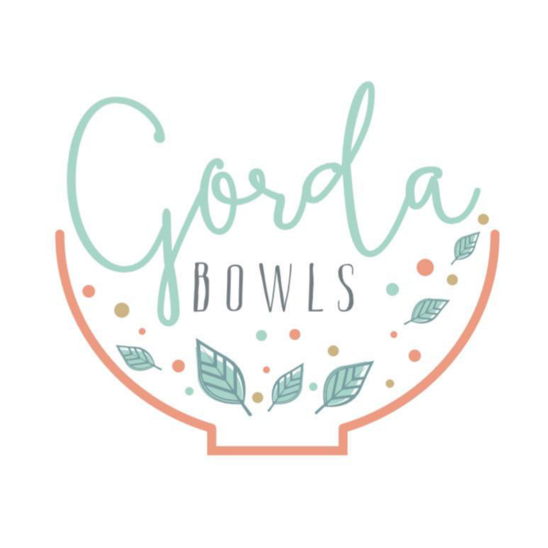Logo for Good Bowls with mint script and peach bowl outline, accented by teal leaves and dots