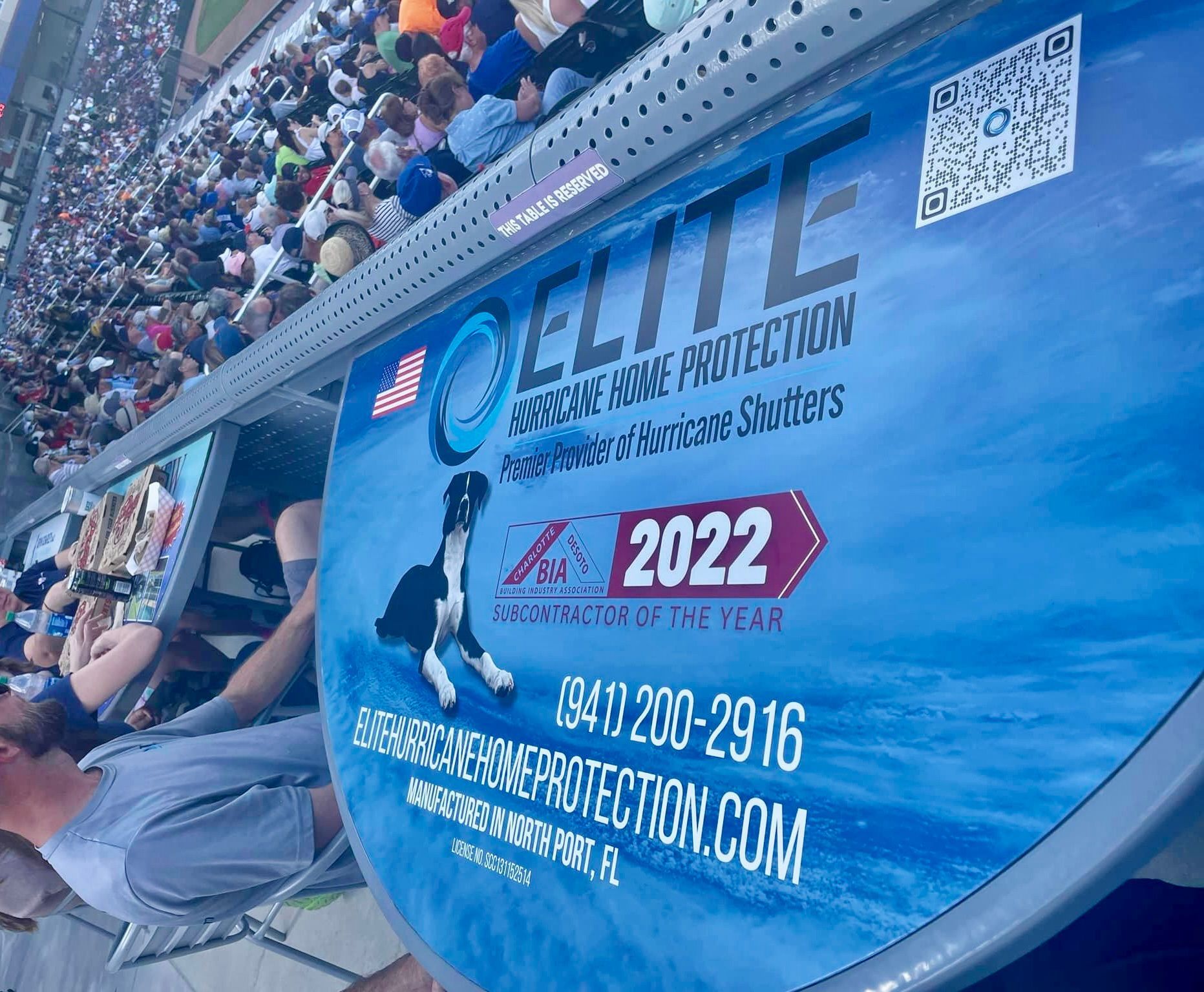Blue Elite Physical Therapy banner at stadium seats, with 2022 logo and contact info.