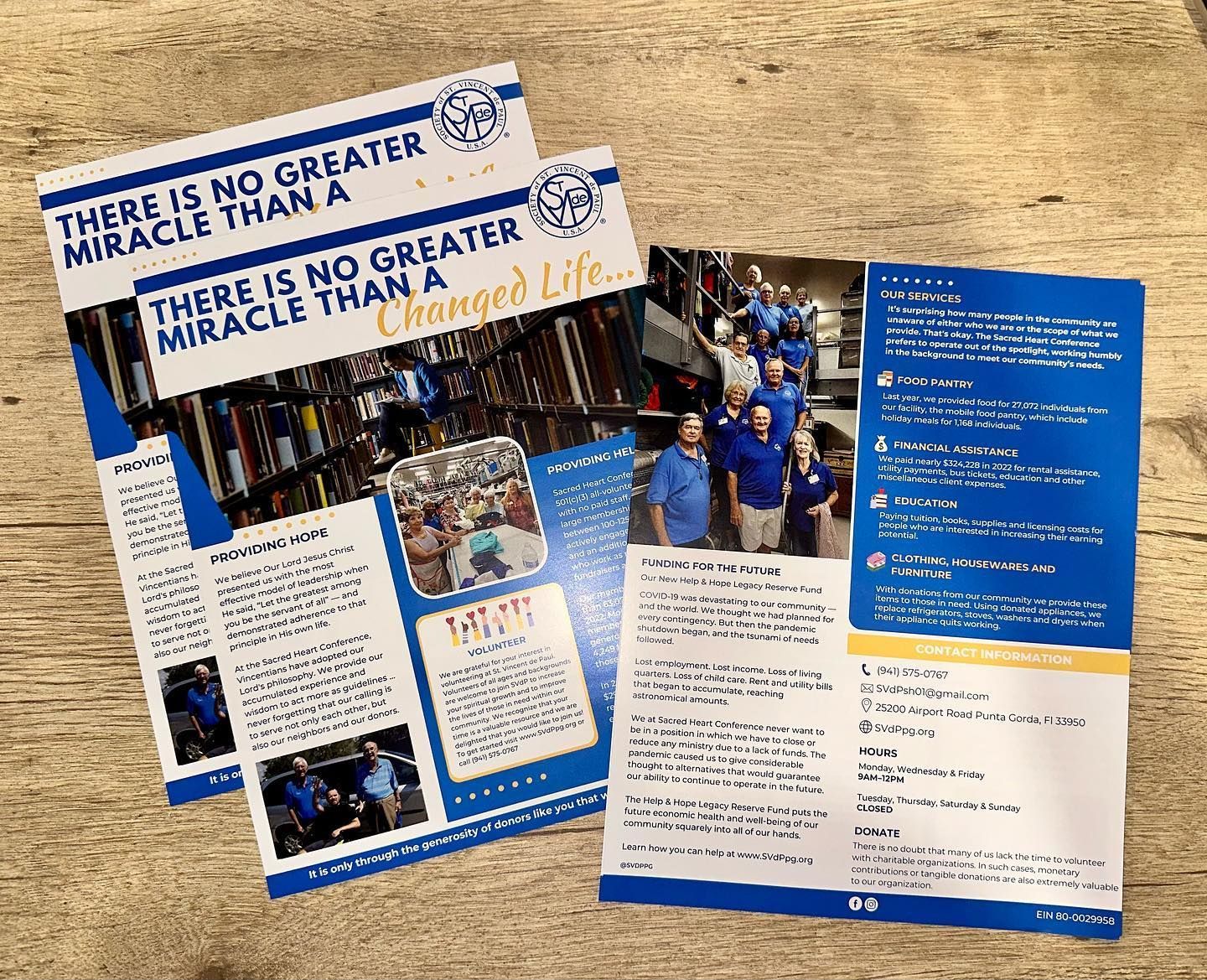 Blue and white flyer collage on a table, promoting a Miracle on 13th street event