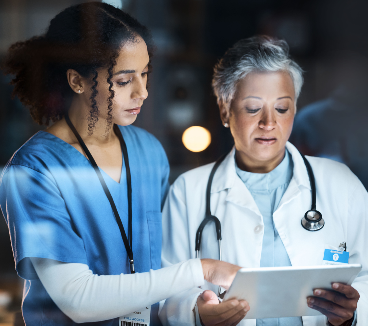 leadmonkey.ai | A nurse and a doctor are looking at a tablet together