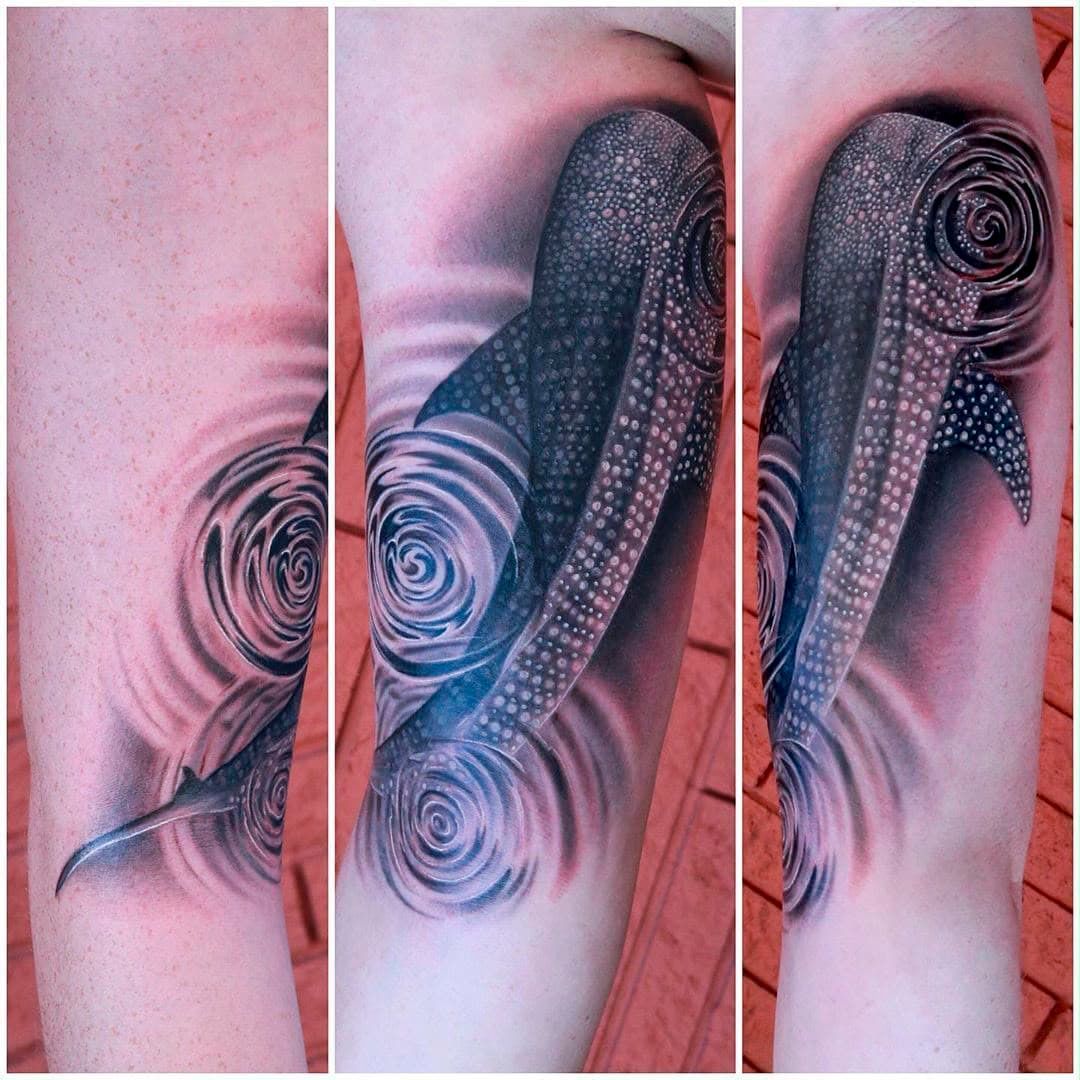 Three-panel tattoo close-up of a black-and-gray design with a spiral motif on skin