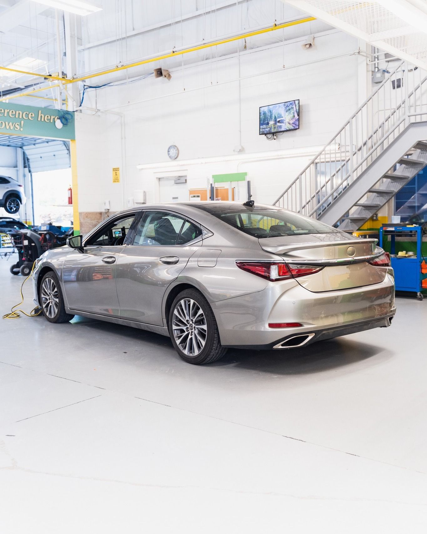 Silver Sedan Positioned In Repair Bay | D&V Autobody Overland