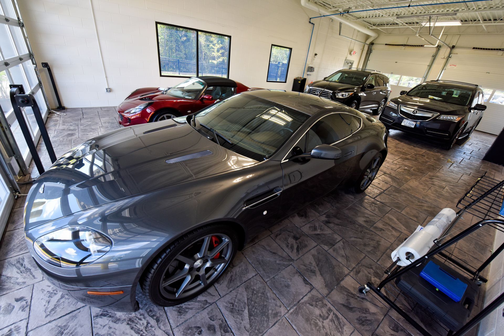 Silver Sports Car Displayed Inside Showroom | D&V Autobody