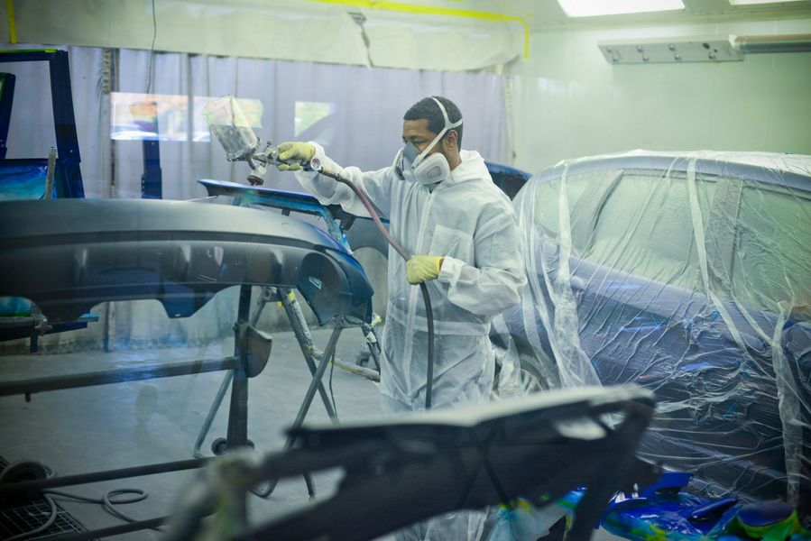 Technician Wearing Mask While Painting Car | D&V Autobody