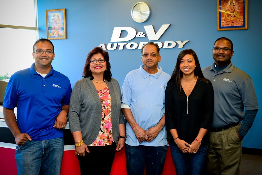 Team Members Standing At D&V Autobody Front Desk | D&V Autobody