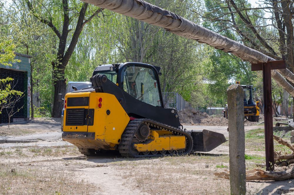 Yellow Skid Steer Loader With Tracks in an Outdoor Setting — Allquip Rentals Pty Ltd in Cooroy, QLD