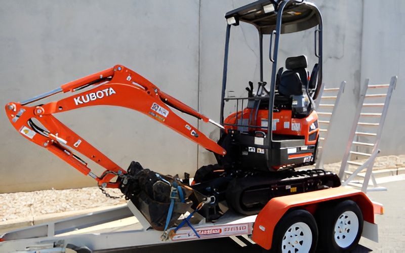 Kubota mini excavator secured on a trailer for excavator hire in Sunshine Coast