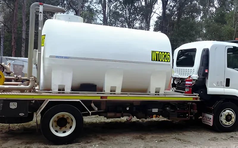 Truck-mounted water tank parked at a Sunshine Coast worksite for construction water haulage