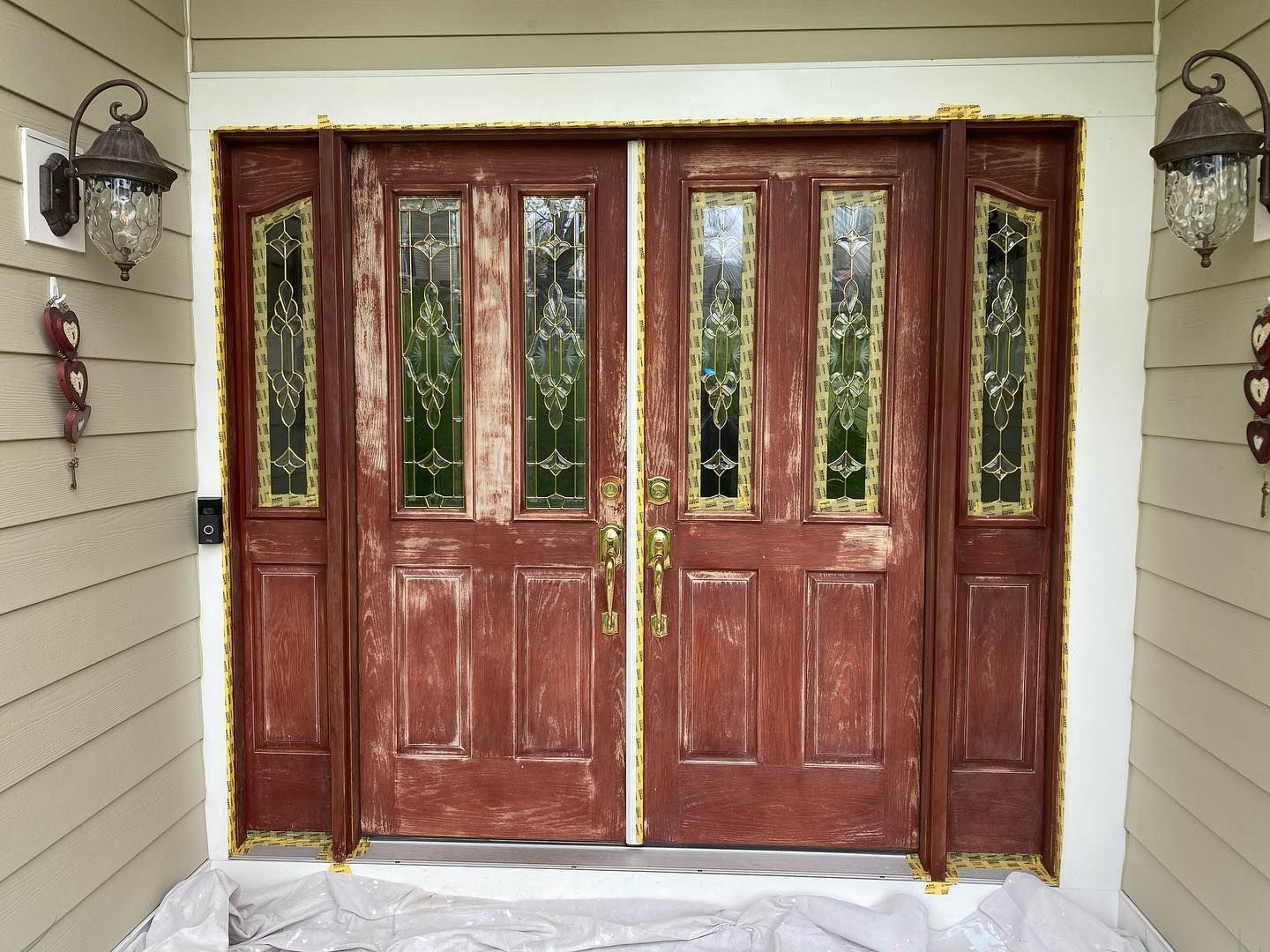 The front door of a house is being painted