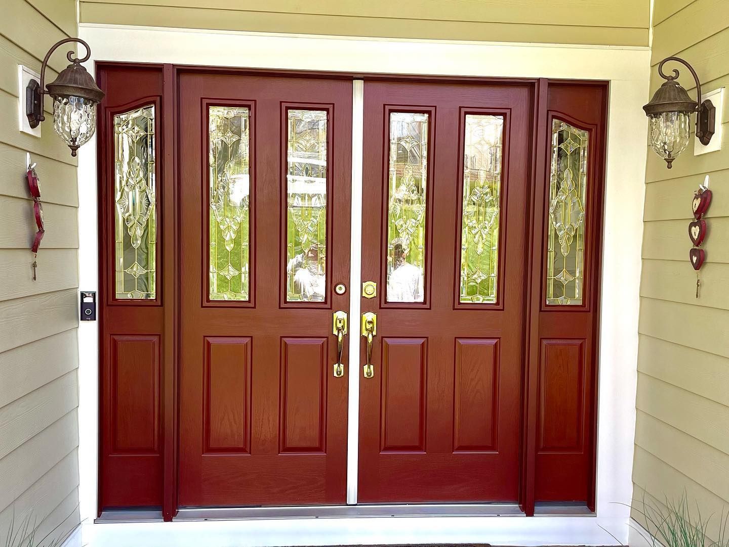 The front door of a house with two red doors