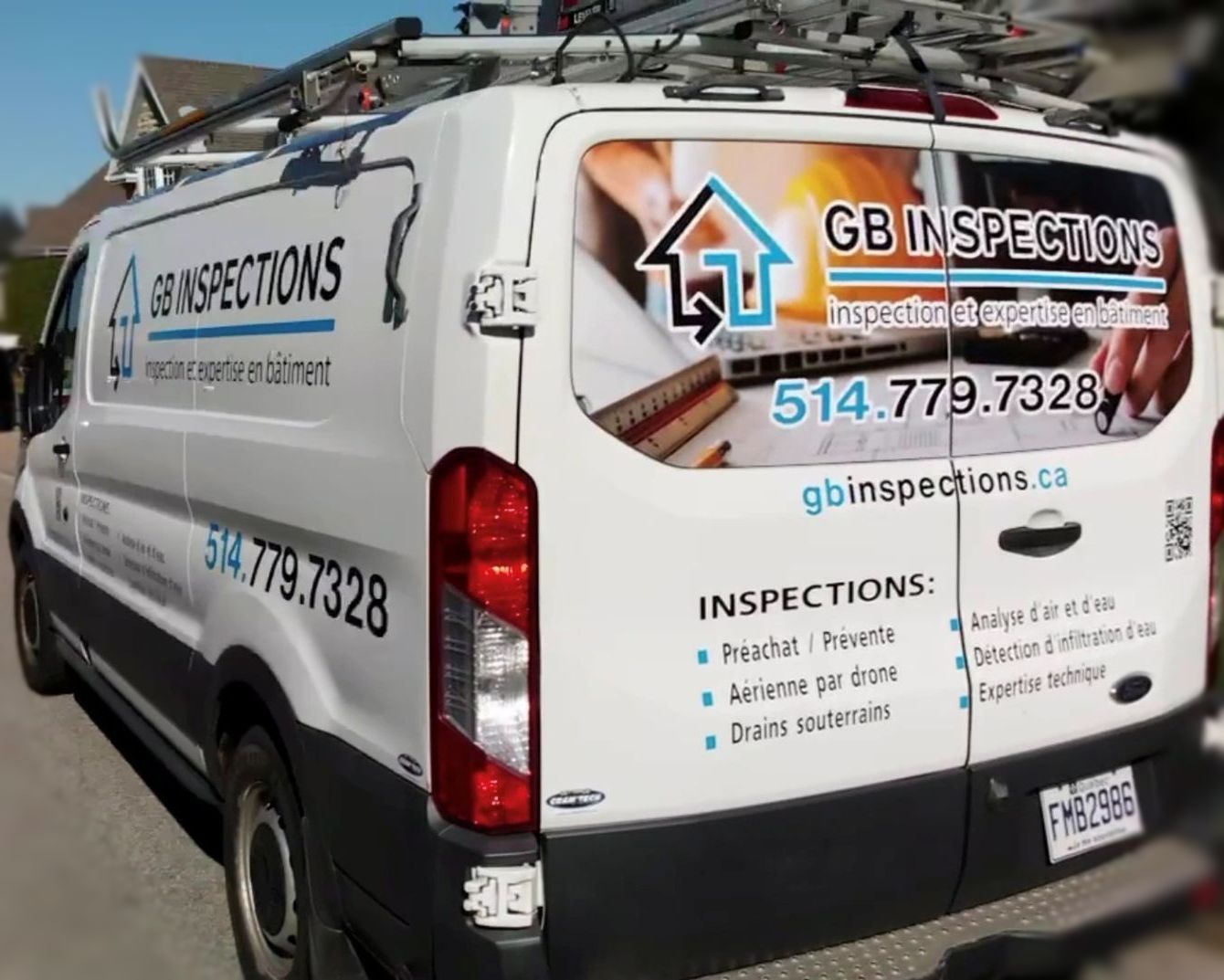 Fourgonnette blanche de GB Inspections avec logo et coordonnées, garée à l'extérieur.
