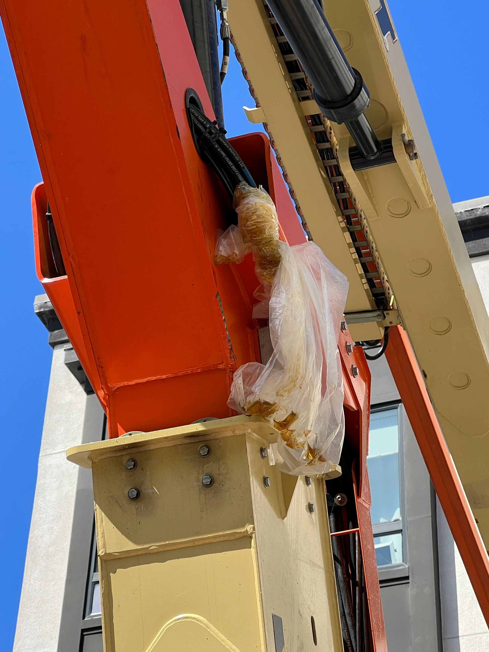 A close up of a crane with a plastic bag on it