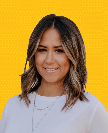 Mandy Hall wearing a white shirt and a necklace is smiling in front of a yellow background | Mortgage Lender in Roseville, CA
