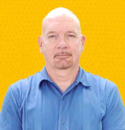 Jeff Silver smiling in a red button-up shirt against a gray studio backdrop | Mortgage Lender in Roseville, CA