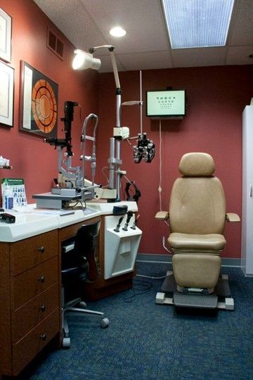 An ophthalmologist's office with a chair and a monitor