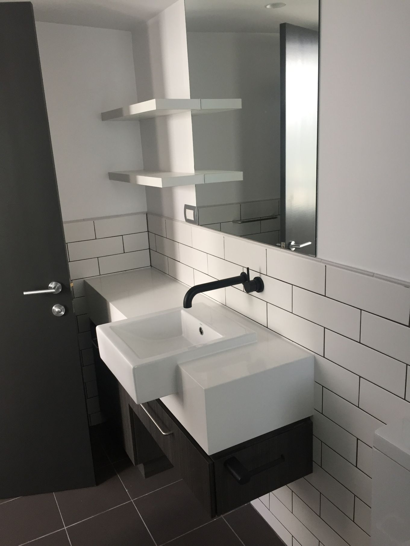 Modern Bathroom With White Sink & Black Tap — Plumbers in Bathurst,, NSW