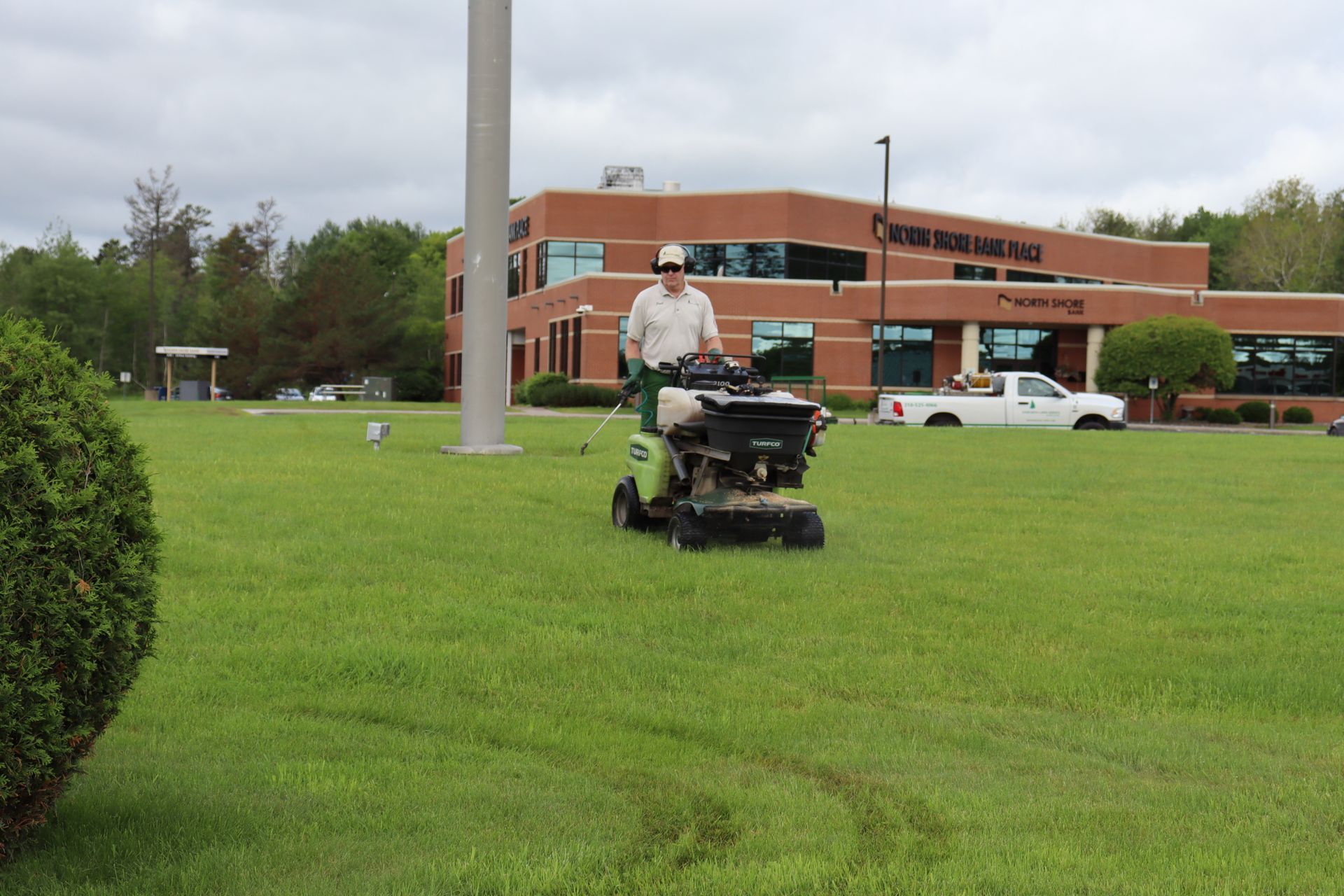 Worker spraying the lawn, showcasing weed control services in Duluth, MN. Worker spraying the lawn, showcasing weed control services in Duluth, MN.