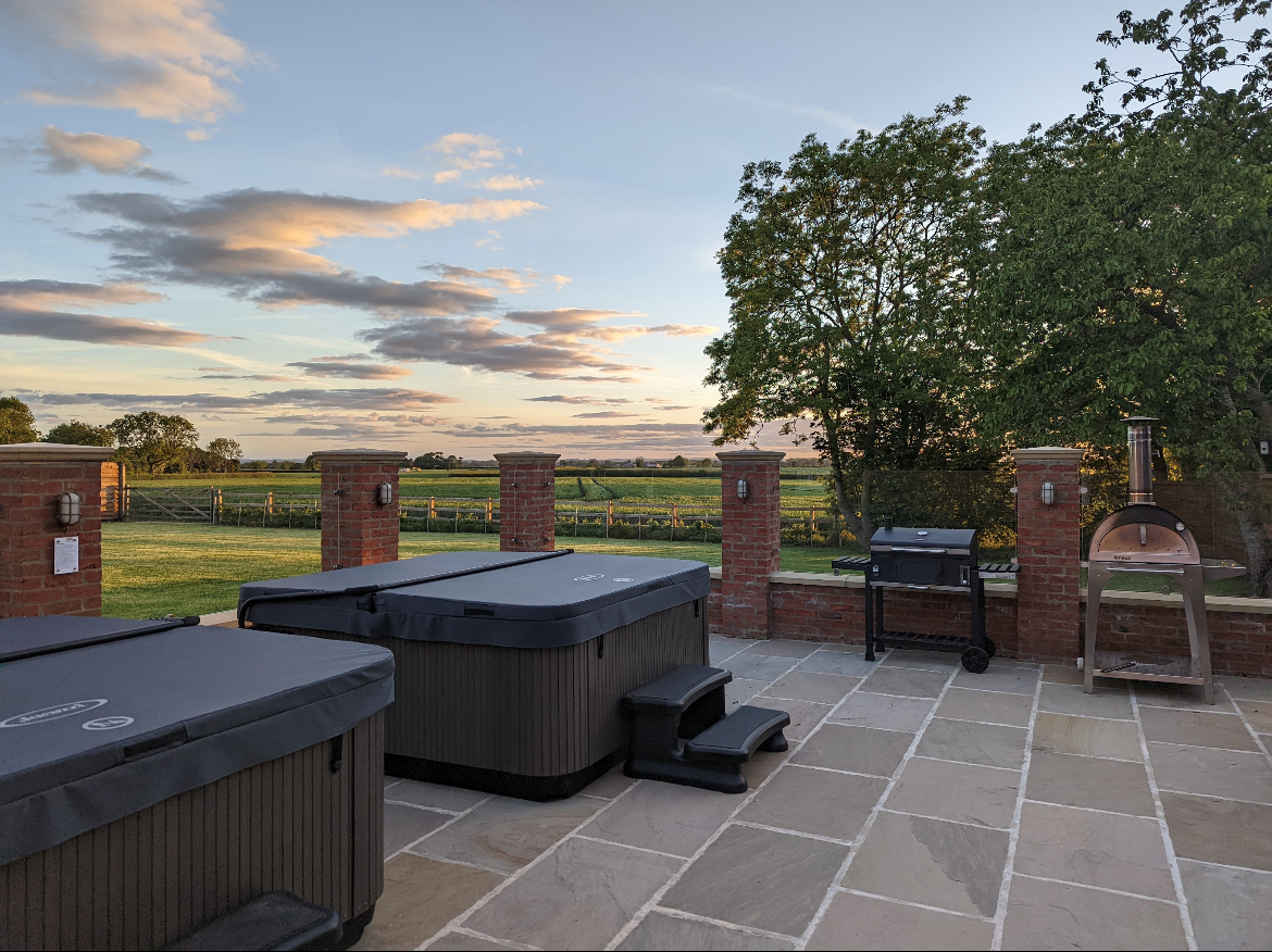 views for miles from the patio, hot tubs, pizza oven and BBQ