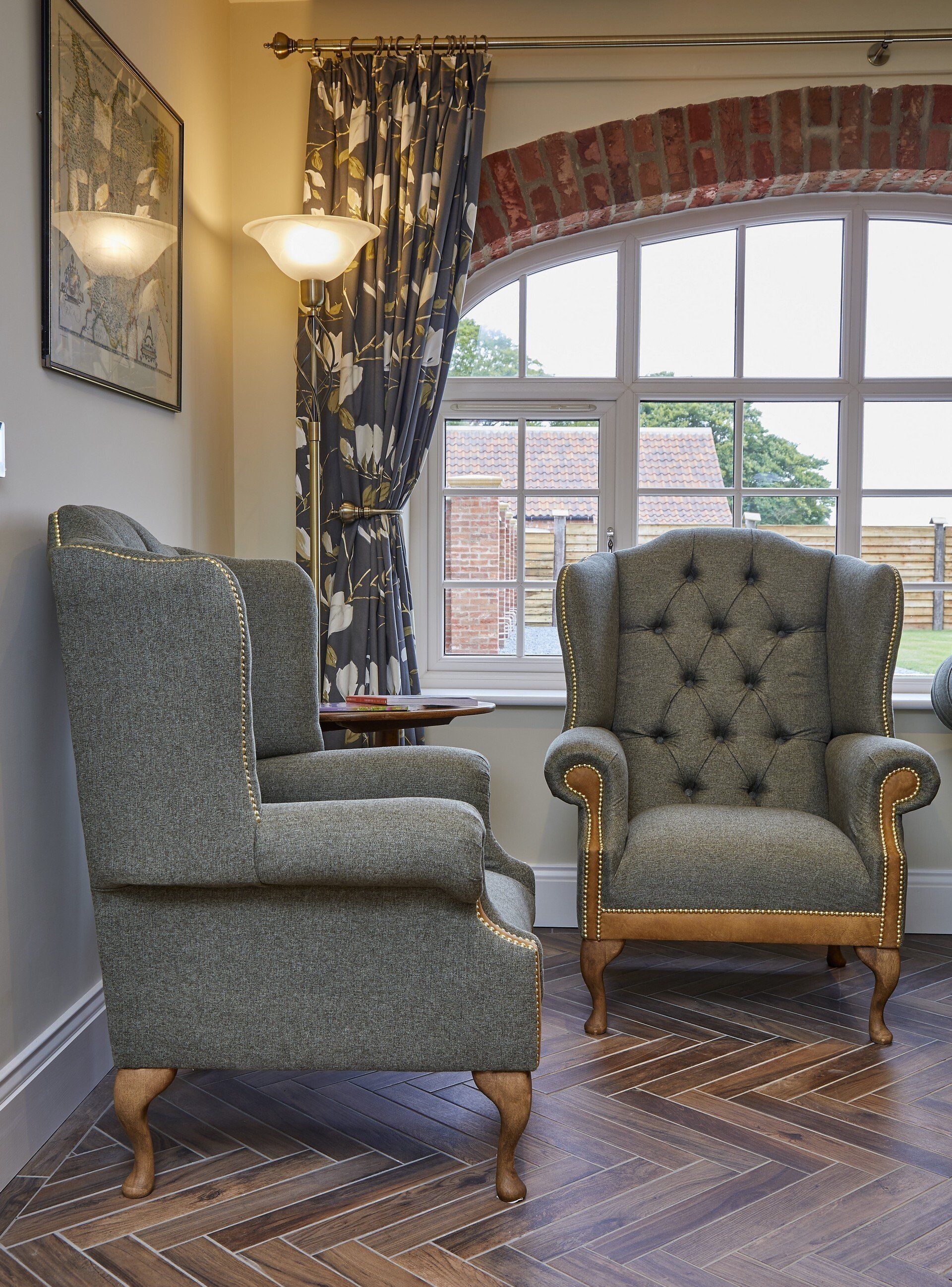 Two chairs are sitting in front of a window in a room