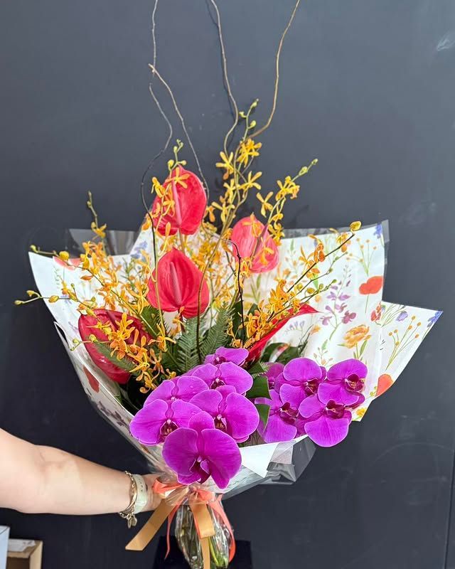 Bouquet of Purple and Yellow Flowers With Green Foliage โ J'adore Flowers & Gifts Cairns in Earlville, QLD