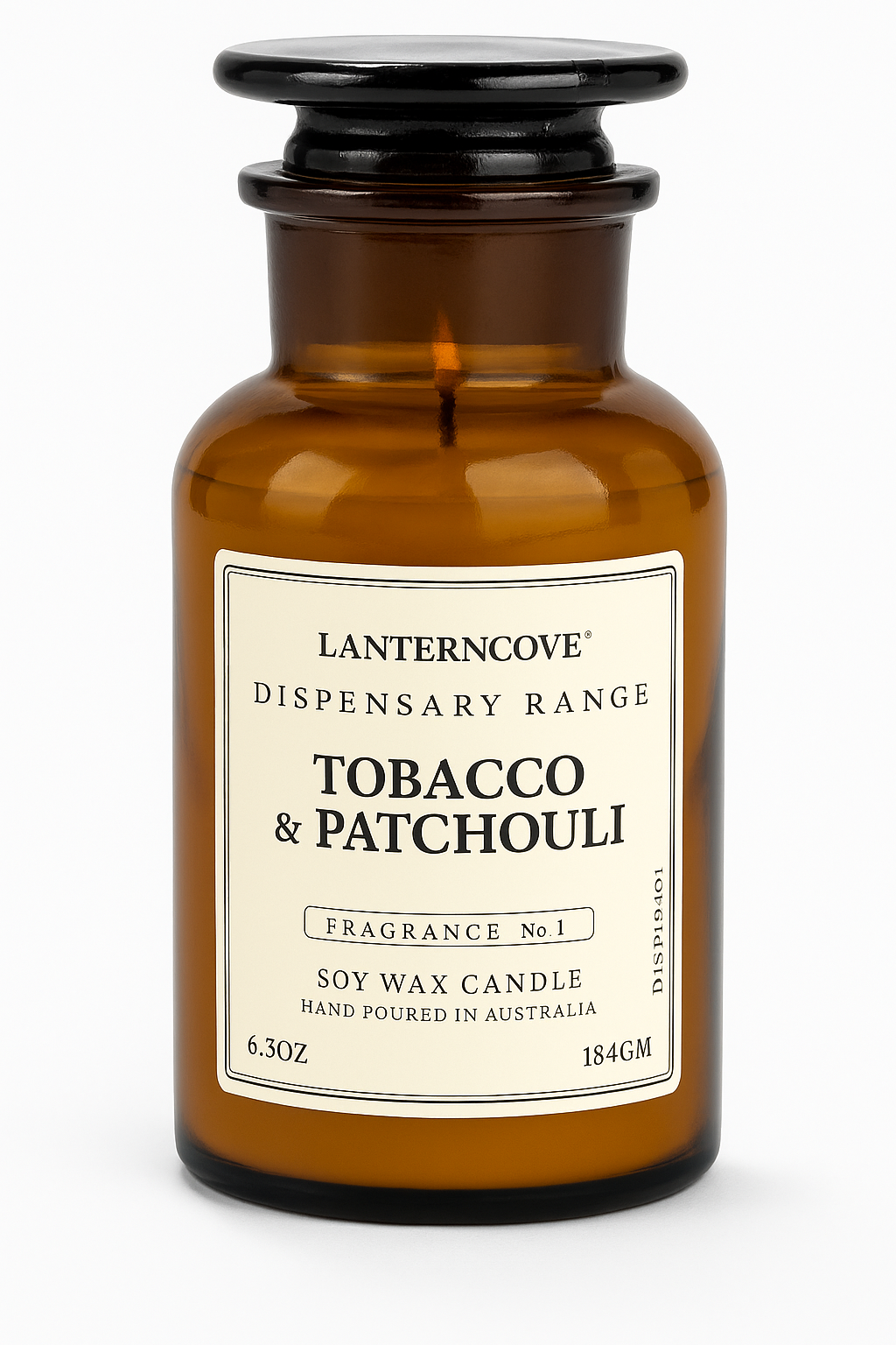 Amber-colored apothecary candle with black lid, labeled 