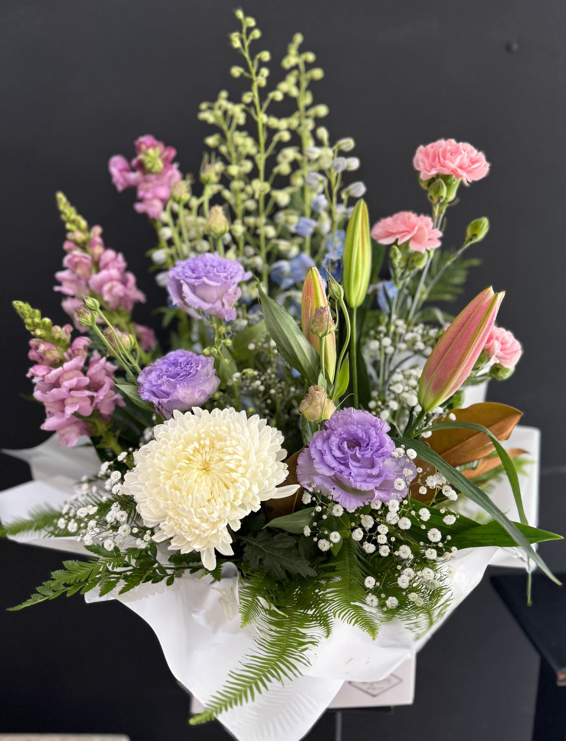 Floral arrangement in white box with pink, purple, and cream-colored flowers - J'adore Flowers & Gifts Cairns in Earlville, QLD