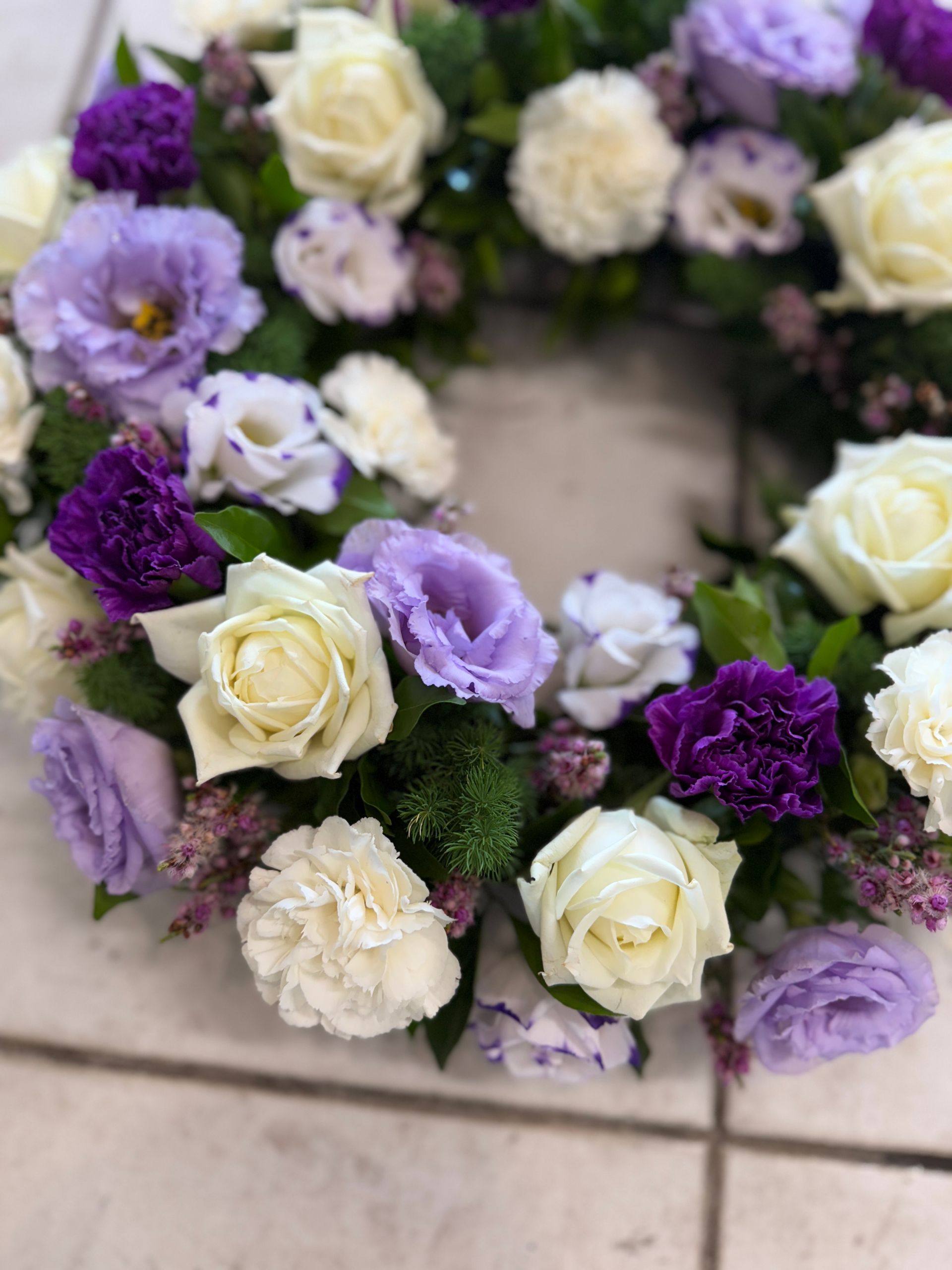 Wreath of White Roses, Lavender Lisianthus, and Purple Carnations โ J'adore Flowers & Gifts Cairns in Earlville, QLD