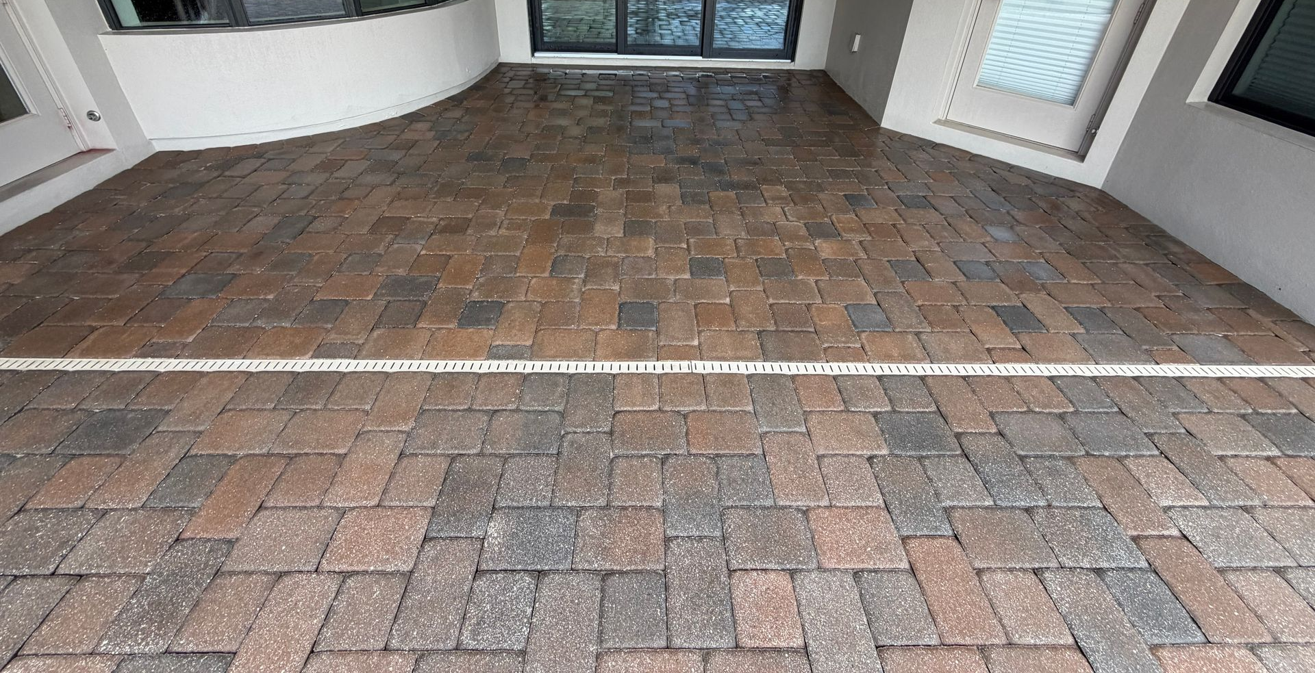 Bringing worn pavers back to life with professional cleaning sanding, and sealing services that restore beauty and durability