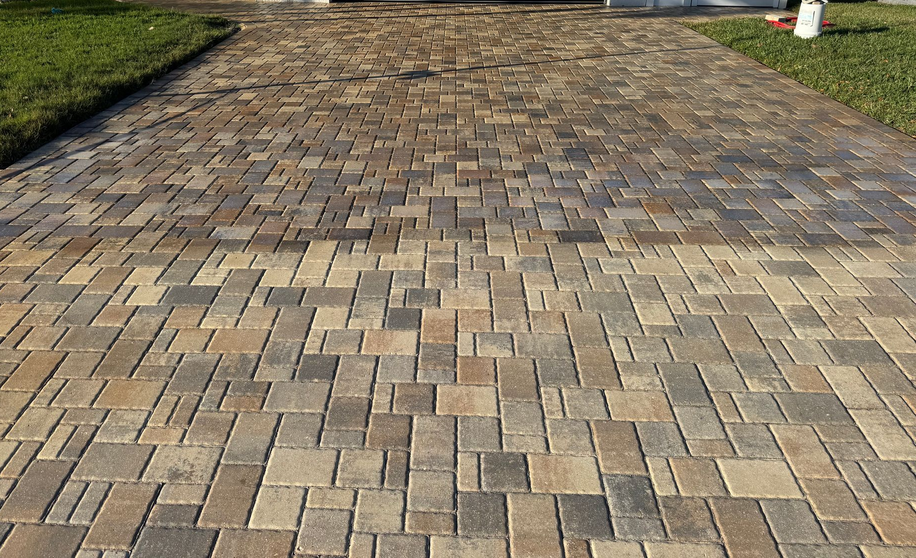 6,000 sqft driveway, walkway, side patios and pool patio paver sealing done correctly in Tampa Bay! Call us today!