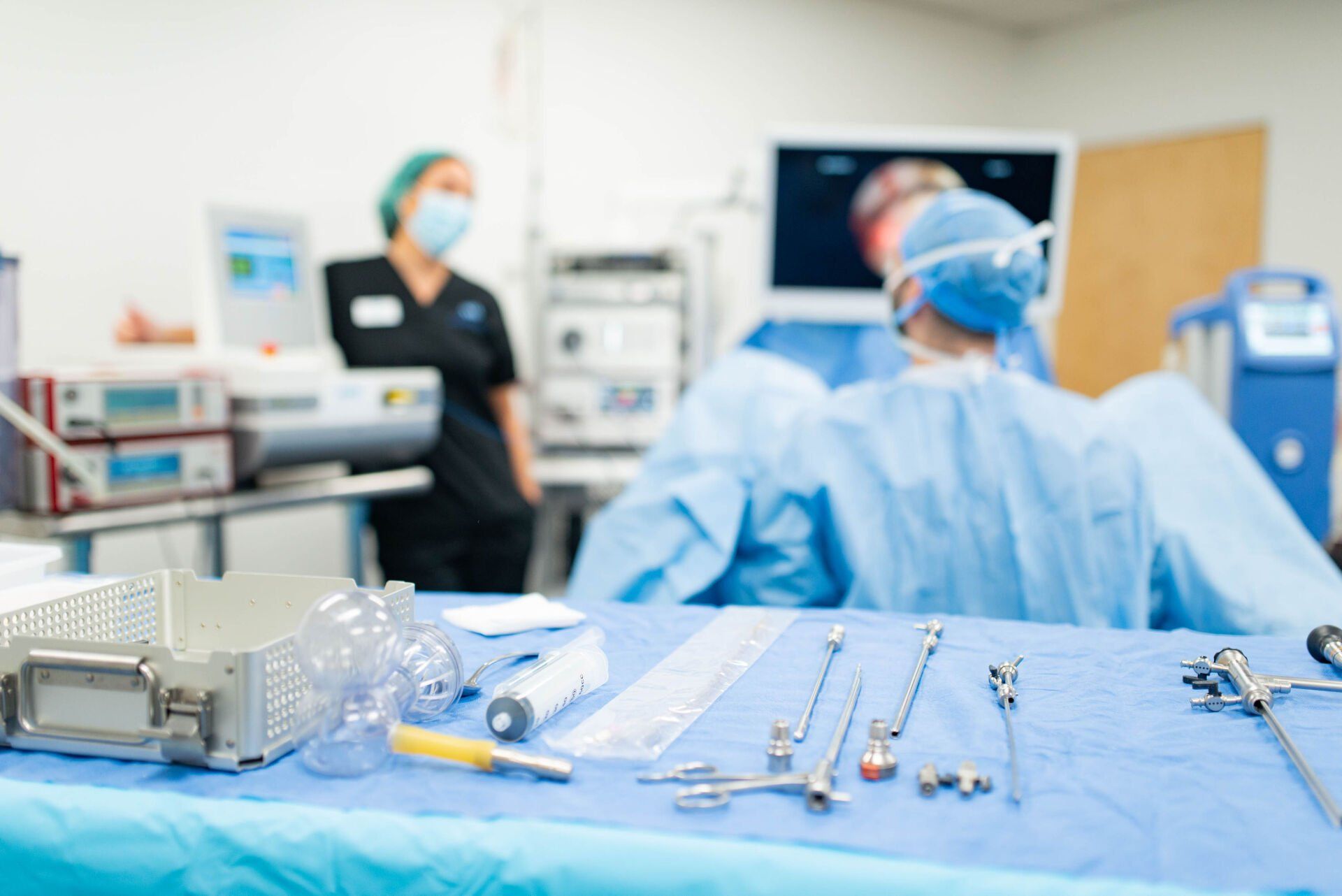 A table with surgical instruments on it in an operating room.